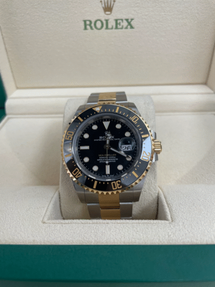 Super Clone Rolex Sea-Dweller 126603 replica with two-tone yellow gold and steel case, black dial, and ceramic bezel