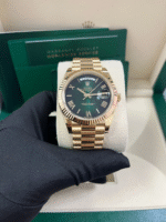 Super Clone Rolex Day-Date 228238 replica with ombre green Roman dial, fluted bezel, and yellow gold case