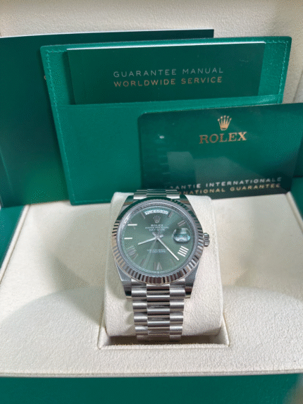 Super Clone Rolex Day-Date 228239 replica with white gold case, olive green bevelled Roman dial, and fluted bezel