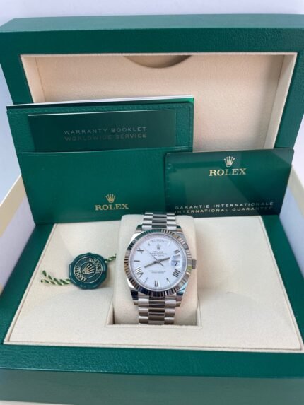 Super Clone Rolex Day-Date 228239 replica with white gold case, white Roman dial, fluted bezel, and President bracelet
