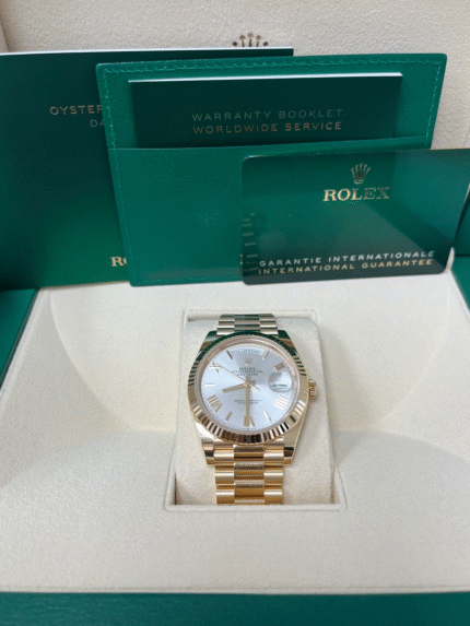 Super Clone Rolex Day-Date 228238 replica featuring yellow gold case, silver Roman dial, fluted bezel, and President bracelet