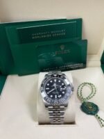 Super Clone Rolex GMT-Master II 126710GRNR replica with black and grey bezel, black dial, and Jubilee bracelet – Swiss GMT replica